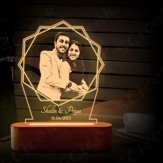 Custom acrylic LED photo frame with personalized engraving and vibrant edge lighting. Perfect gift for birthdays, anniversaries, or home décor.